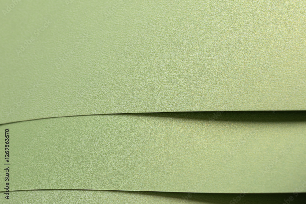 Fototapete muted olive green paper background with a smooth matte texture and layered folds. soft sage and moss