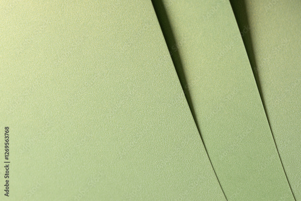 Poster muted olive green paper background with a smooth matte texture and layered folds. soft sage and moss