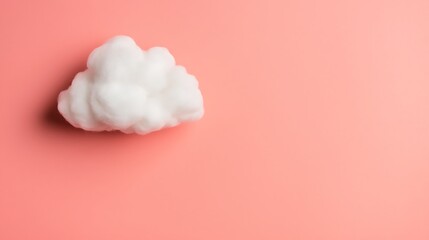 A fluffy white cloud rests on a soft pink background, creating a serene and whimsical atmosphere.