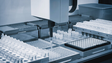 automatic machine in a medical or pharmaceutical laboratory fills ampoules with a vaccine or...