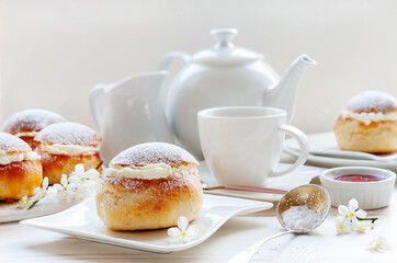 Homemade Semla or semlor, vastlakukkel, laskiaispulla - traditional Scandinavian sweet bun especially Fastelavn Shrove Monday and Shrove Tuesday.