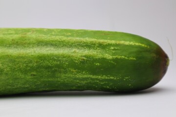 Fresh and Healthy Green Cucumber Isolated on a White Background Ready to Eat