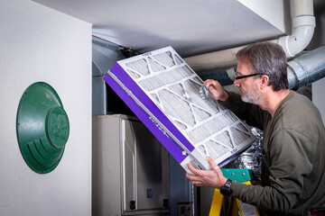 Furnace filter inspection with a magnifying glass