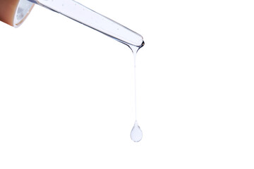 Pipette with delicate blue serum close-up.