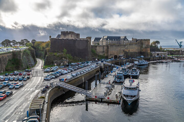 A view along the banks of the Penfield river towards the military castle at Brest, France in autumn