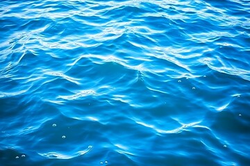 Obraz premium Water drops on blue background. Water drops on blue water surface.