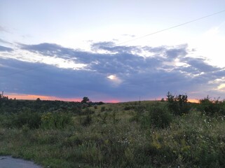 Nature's Palette: The Beauty of a Sunset Over Fields