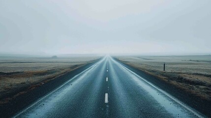 Minimalist Composition of a Single Asphalt Lane in Foggy Landscape