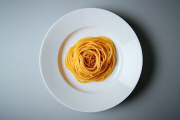 A generous serving of spaghetti bolognese is elegantly plated on a white dish, showcasing its rich sauce and pasta texture