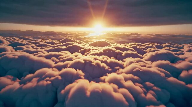 Gorgeous sunset above the clouds in the sky. Sunrays breaking through the clouds. amera rises above the clouds to see the bright sunset sky and the sun