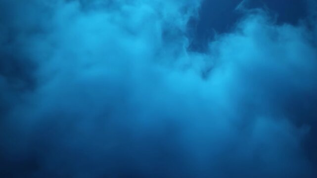 Soft blue clouds drift gently overhead during a serene moment at dusk