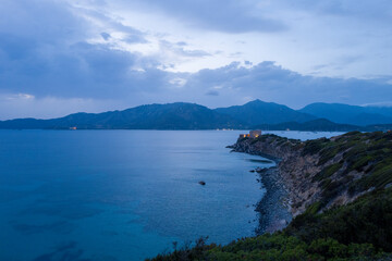 Fototapeta premium Capo Carbonara at night in Cala Caterina in Europe, Italy, Sardinia, Cala Caterina, in summer, on a sunny day.