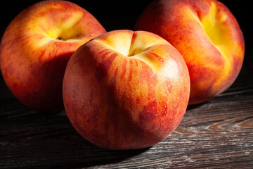 peach on black wood background