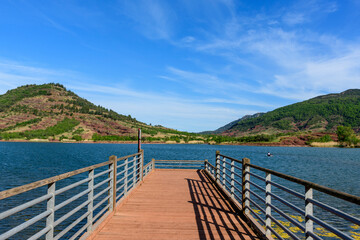 Obraz premium The pontoon of Lake Salagou in Europe, France, Occitanie, Herault, Clermont l Herault, in summer, on a sunny day.