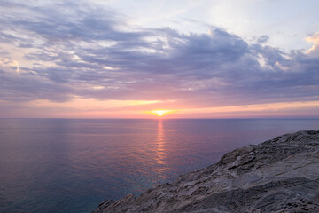 Obraz premium The cliffs of Stintino at sunset in Europe, Italy, Sardinia, Stintino, in summer, on a sunny day.