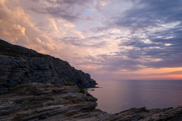 The cliffs of Stintino at sunset in Europe, Italy, Sardinia, Stintino, in summer, on a sunny day.
