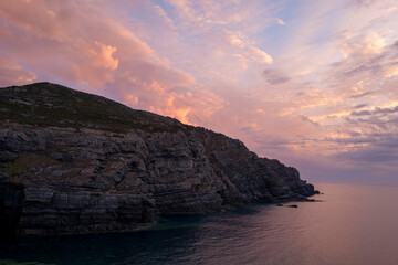 The cliffs of Stintino at sunset in Europe, Italy, Sardinia, Stintino, in summer, on a sunny day.