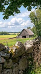 Obraz premium Traditional Farmhouse Exterior Surrounded by Lush Green Fields