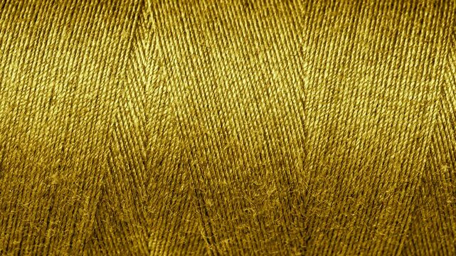 gold cotton threads with visible details. background