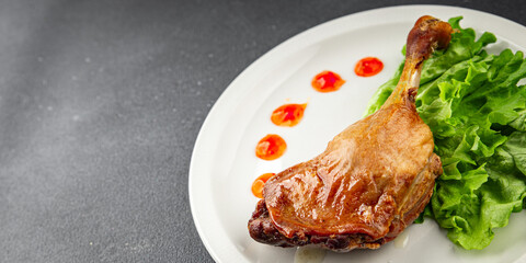 Duck leg confit baked bird meat fresh tasty food dish delicious gourmet food background on the table rustic food top view copy space