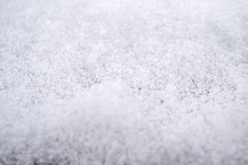 close-up photograph of a snow texture, individual flakes are visible, macro photography taken from different angles and differentiated focus