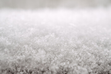close-up photograph of a snow texture, individual flakes are visible, macro photography taken from different angles and differentiated focus