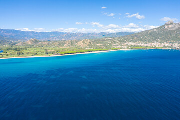 Fototapeta premium The coast seen from the sea in Lotzorai in Europe, Italy, Sardinia, Lotzorai, in summer, on a sunny day.