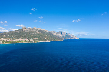 The cliffs by the sea in Lotzorai in Europe, Italy, Sardinia, Lotzorai, in summer, on a sunny day.