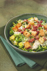Brussels sprouts Caesar salad, with bacon and croutons, healthy food, homemade, no people,