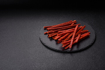 Jerky dried fish sticks with salt and spices