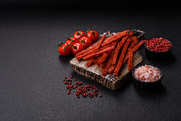 Jerky dried fish sticks with salt and spices