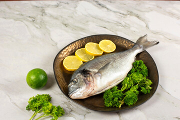 sea bream fish with lemon slices
