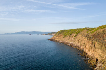 Fototapeta premium The arid coast at Punta di Foghe in Europe, Italy, Sardinia, Punta di Foghe, in summer, on a sunny day.