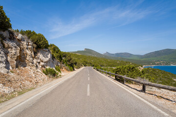 The road to the Porto Conte natural park in Europe, Italy, Sardinia, Porto Conte, in summer, on a sunny day.