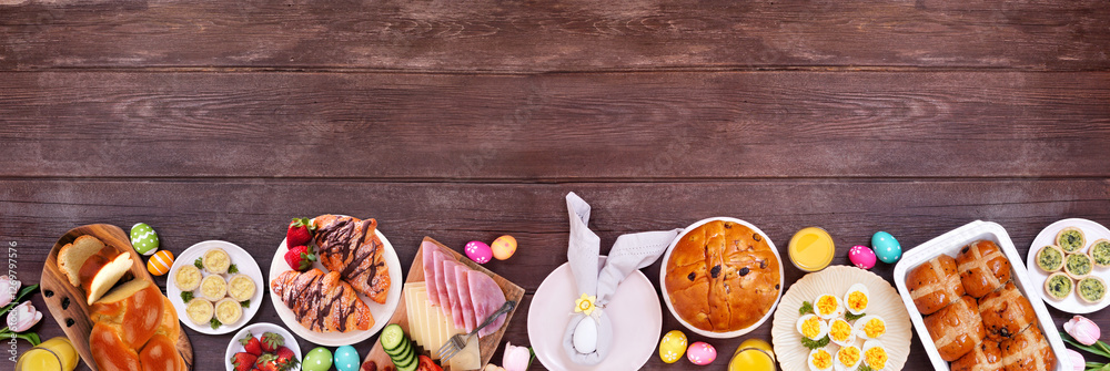 Poster easter breakfast or brunch bottom border. top down view on a dark wood banner background. breads, qu