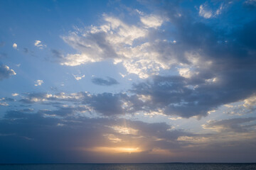 Sunset over the sea towards Oristano in Europe, Italy, Sardinia, Oristano, in summer, on a sunny day.