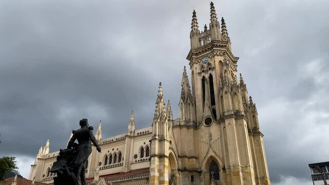 Church of Our Lady of Lourdes in Chapinero neighborhood, city of Bogota, Colombia. Antonio Jose de Sucre monument is seen on the left.