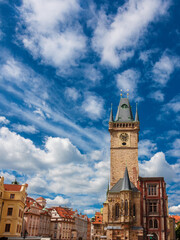 Old Town Hall in Prague with medieval clock tower and beautiful white clouds