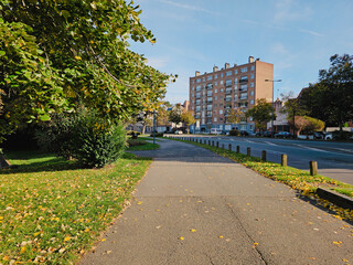 Charming European street with historic buildings and intricate architectural details.