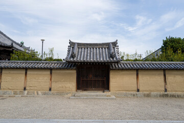 Fototapeta premium The small gate of Horyu-ji in Nara in Asia, Japan, Kansai, Nara, in summer, on a sunny day.