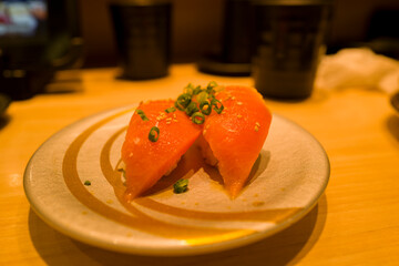 Salmon sushi in Osaka in Asia, Japan, Kansai, Osaka, in summer, on a sunny day.