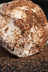 sweet melting white ice cream with chocolate chips in a waffle cone