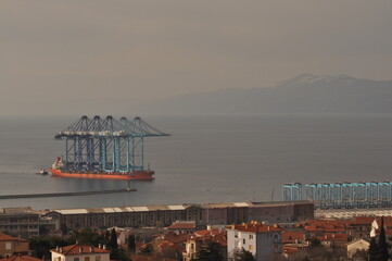 Rijeka, Croatia 17.02.2025. Ship transporting new crain's for Rijeka container terminal. Crain's were deported from China during 70 days of sailing to Rijeka harbour in Europe