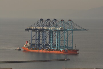 Rijeka, Croatia 17.02.2025. Ship transporting new crain's for Rijeka container terminal. Crain's were deported from China during 70 days of sailing to Rijeka harbour in Europe