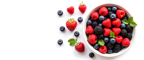 Fresh, colorful bowl of mixed berries including strawberries, blueberries, and blackberries with mint leaves, conveying a vibrant and healthy lifestyle