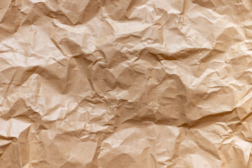 Crumpled kraft paper, abstract background.
