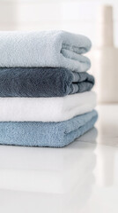 Cozy collection: vertical close-up of soft folded towels for bathroom decor