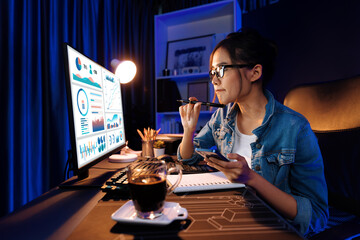 Host channel Asian influencer talking in broadcast wearing headsets on social media with pc in business graph screen, greeting listeners and coaching market online at neon modern studio. Stratagem.