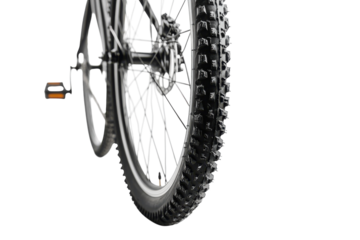 A close-up view of a mountain bike tire showcasing detailed tread patterns against a light backdrop isolated on transparent background