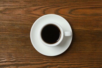 Cup of coffee on wooden background